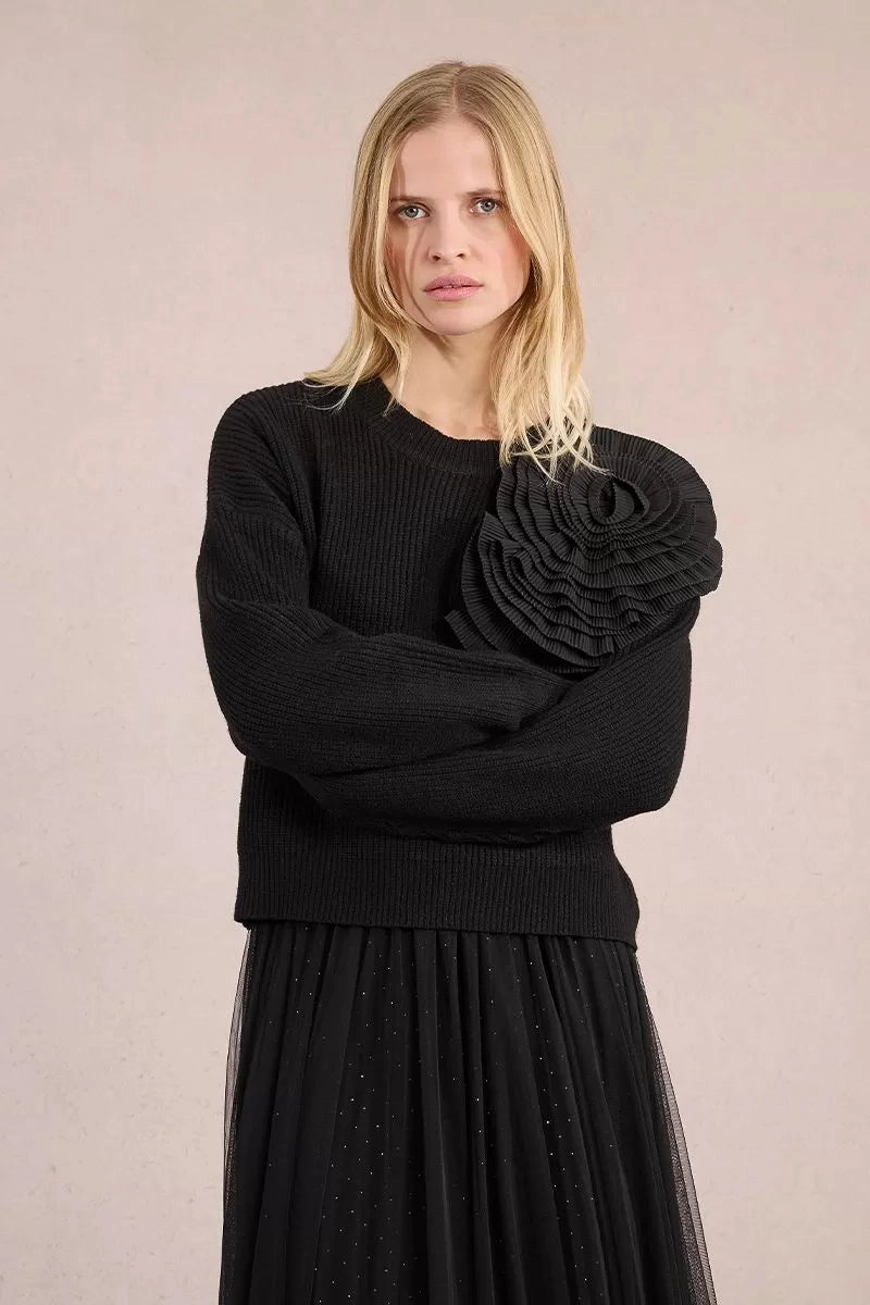 LowMaintenanceMaterial FrictionReducing Asymmetrical Rose Sweater in Black